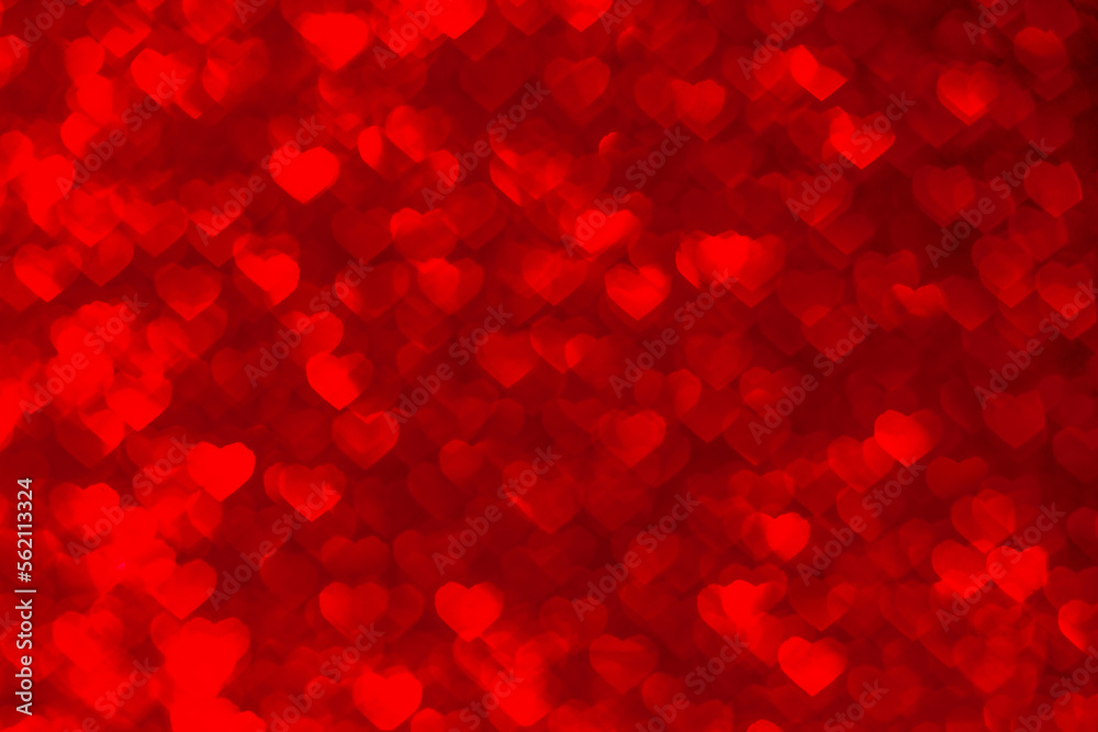 Abstract background of red blurred hearts, bokeh on Valentine's Day