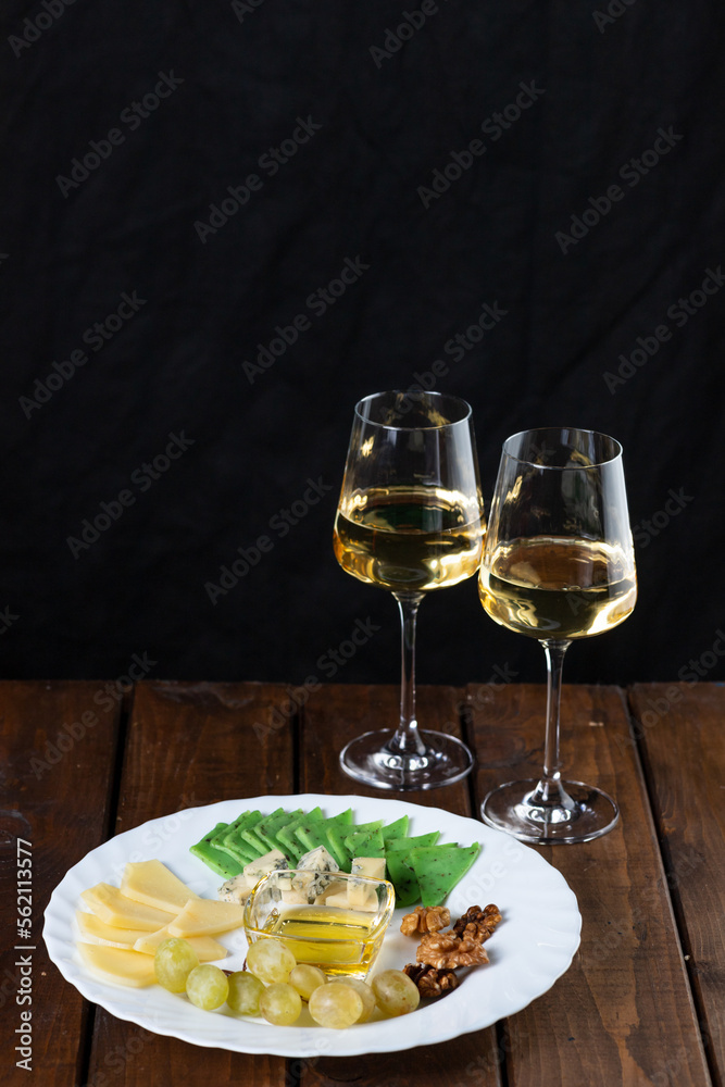 Cheese plate and wine glasses