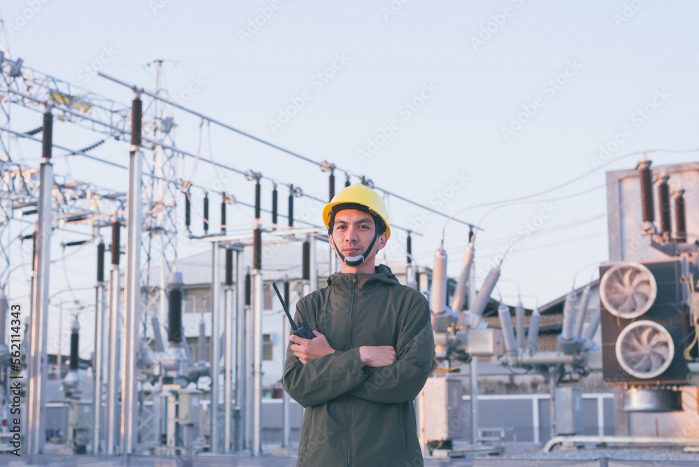 Electrical engineer standing at the power substation
