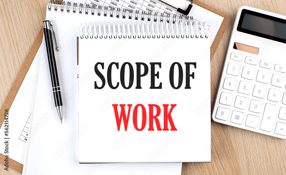 SCOPE OF WORK is written in white notepad near a calculator, clipboard and pen. Business concept SCOPE OF WORK is written in white notepad near a calculator, clipboard and pen. Business concept