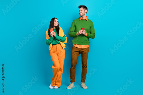 Photo of two bloggers guy lady communicate gadget search facebook instagram friends request isolated blue color background