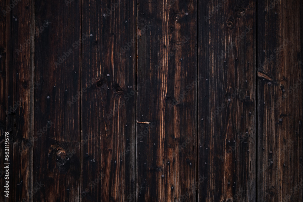 Old dark brown wood background texture.