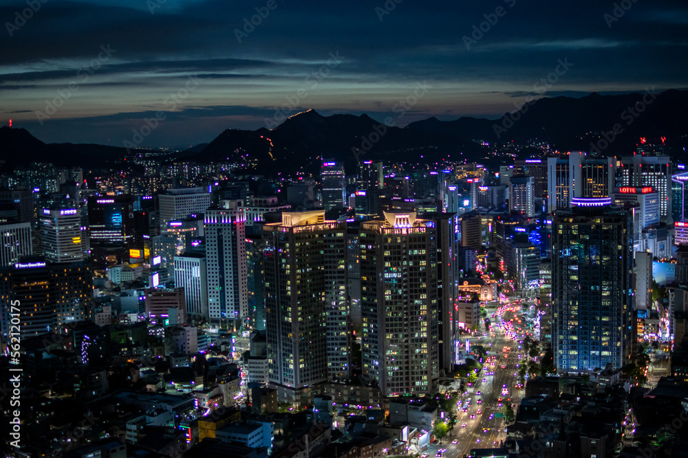 Shooting a tower view of Megapolis with skyscrapers under the night sky. Nightscape of Seoul City, the capital of Korea. High-resolution photo source