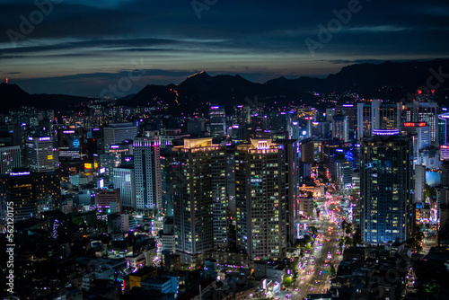 Photography Shooting a tower view of Megapolis with skyscrapers under the night sky
