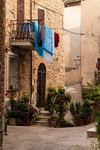 Fototapeta Naklejka Na Ścianę i Meble -  View of old narrow street in  Italy. Architecture of small town. Cozy
