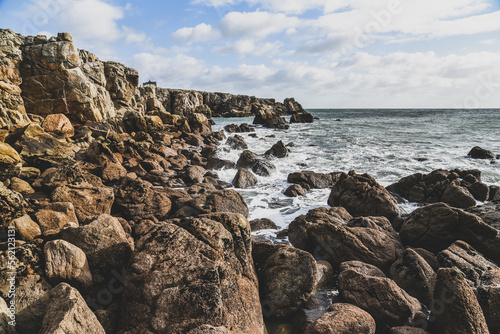 Beautiful and wild rocky coast of France in vintage retro tones, vintage landscape of coastline of France..