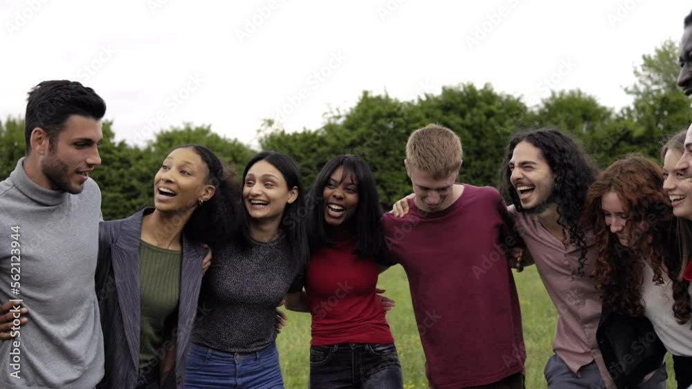 Happy multiracial group of friends having fun outdoor in city park Happy multiracial group of friends having fun outdoor in city park