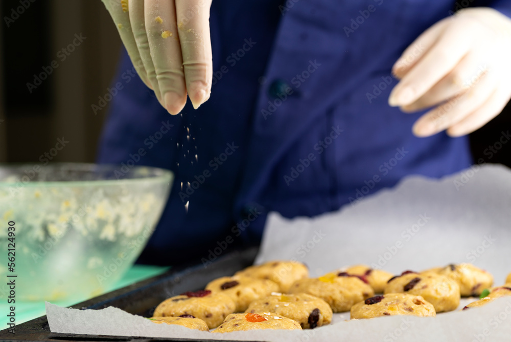 Oatmeal cookies with candied fruits on a baking sheet Oatmeal cookies with candied fruits on a baking sheet
