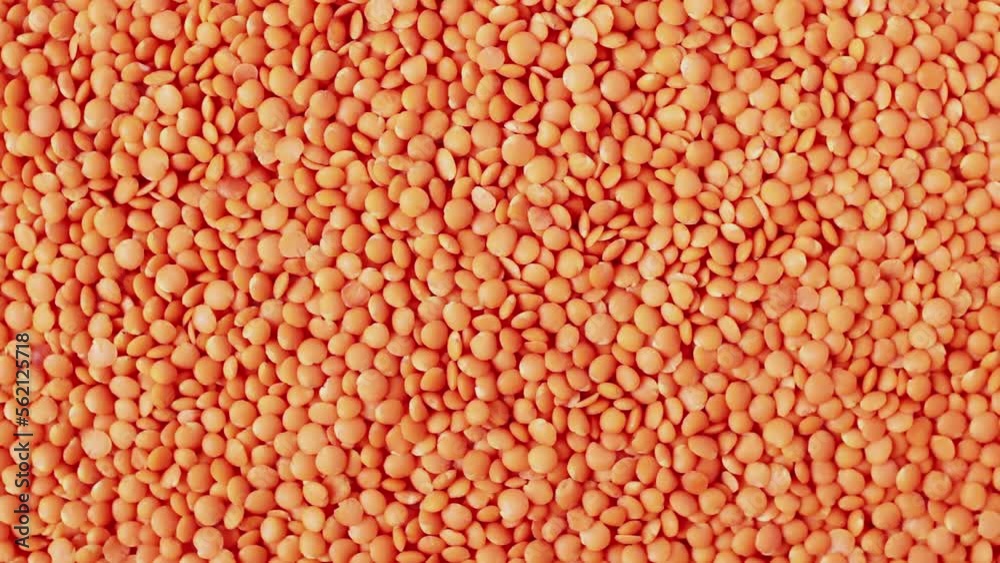 Red raw lentils rotating. Food background. Top View. Healthy food. Ingredient for Turkish Lentil Soup. Red raw lentils rotating. Food background. Top View. Healthy food. Ingredient for Turkish Lentil Soup.