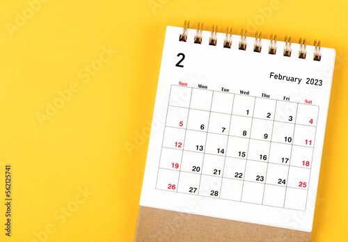 The February 2023 Monthly desk calendar for 2023 year on yellow background.