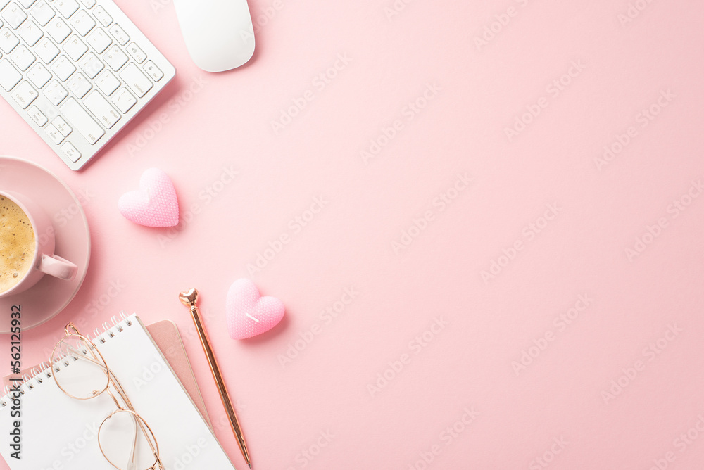St Valentine's Day concept. Top view photo of notepad pen keyboard computer mouse glasses heart shaped candles and cup of coffee on saucer on isolated pastel pink background with copyspace St Valentine's Day concept. Top view photo of notepad pen keyboard computer mouse glasses heart shaped candles and cup of coffee on saucer on isolated pastel pink background with copyspace