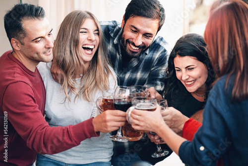 Millennials Cheers: Young Friends Toast to Good Times with Wine and Beer photo