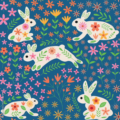 Cute white  Bunny rabbits with beautiful whimsical spring flowers seamless pattern in orange, pink, yellow on blue background. For textile, easter fabric and surface textures 