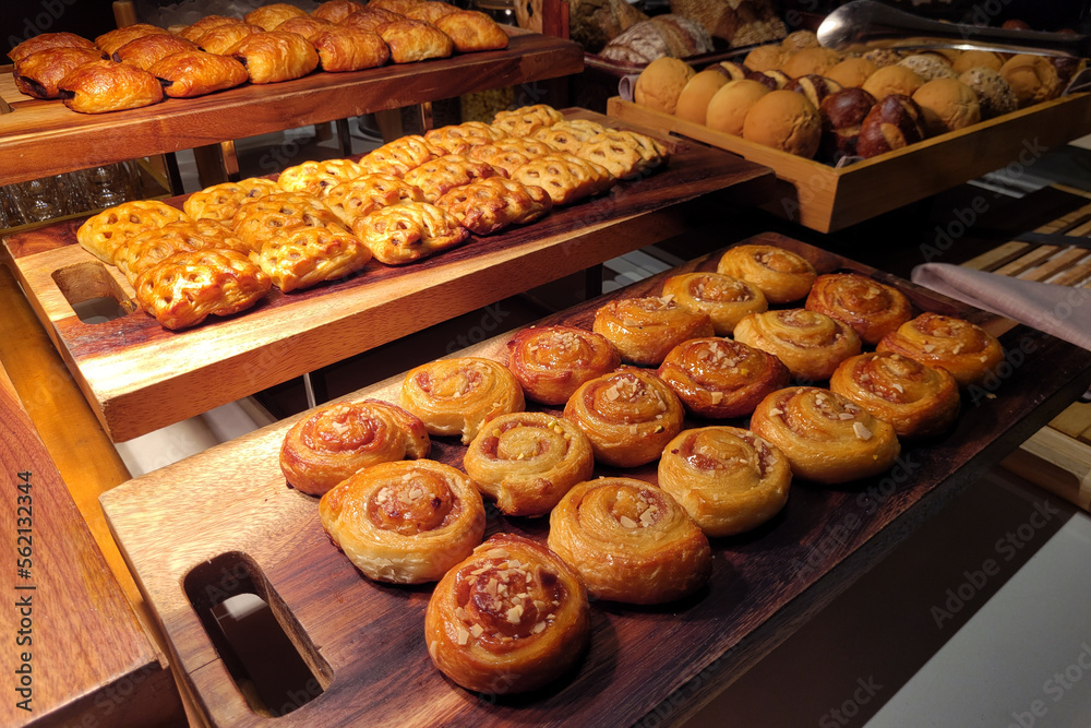 Various selection of pasty, sweet buns and cupcakes display on buffet table Various selection of pasty, sweet buns and cupcakes display on buffet table