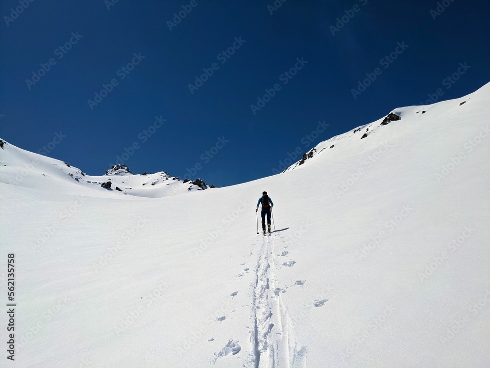  ski mountaineering on the sentisch horn from the fluela pass near davos klosters in the graubunden swiss mountains. ski