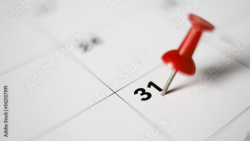 Tableau sur toile Embroidered red pins on a calendar on the 31 st  with selective focus