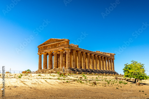 Agrigento, Sicily, Italy - July 12, 2020: Greek ruins of Concordia Temple in the Valley of Temples near Agrigento in Sicily photo