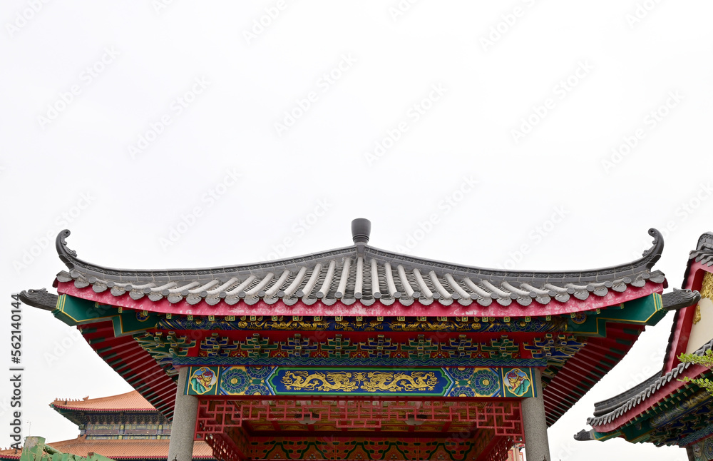 BANGKOK, THAILAND - January 16, 2023 : Part of the Roof of chinese temple in Thailand. Traditional Chinese style pattern on the roof of a temple with Blue Sky Background. BANGKOK, THAILAND - January 16, 2023 : Part of the Roof of chinese temple in Thailand. Traditional Chinese style pattern on the roof of a temple with Blue Sky Background.