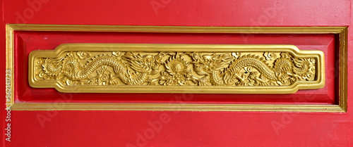 NONTHABURI, THAILAND - January 16, 2023 : Wooden door golden dragon at Dragon Temple Kammalawat or Wat Lengnoeiyi is a chinese temple in Thailand photo