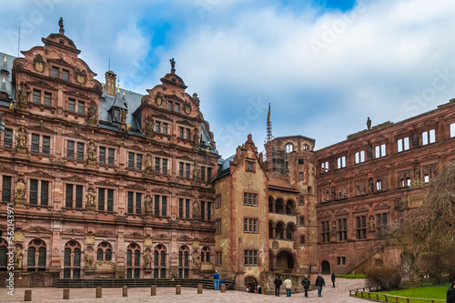 The courtyard of the castle ruin Heidelberger Schloss, Germany. Between the Friedrich’s Wing and the Ottheinrich’s Wing stands the Hall of Glass with its stair tower which has a sundial on its facade.