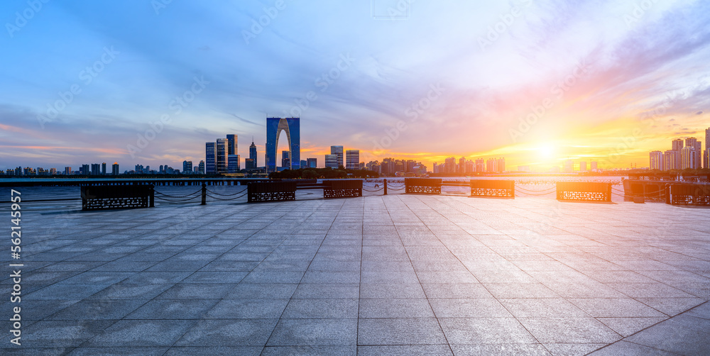 Empty floor and modern city skyline with building at sunset in Suzhou, China.