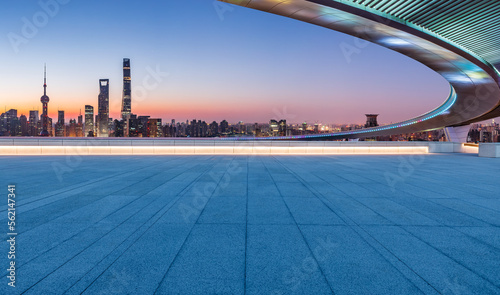 Empty square floor and bridge with city skyline at sunrise in Shanghai  China.