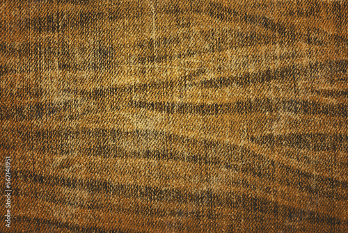 Dirty brown crumpled denim texture as background