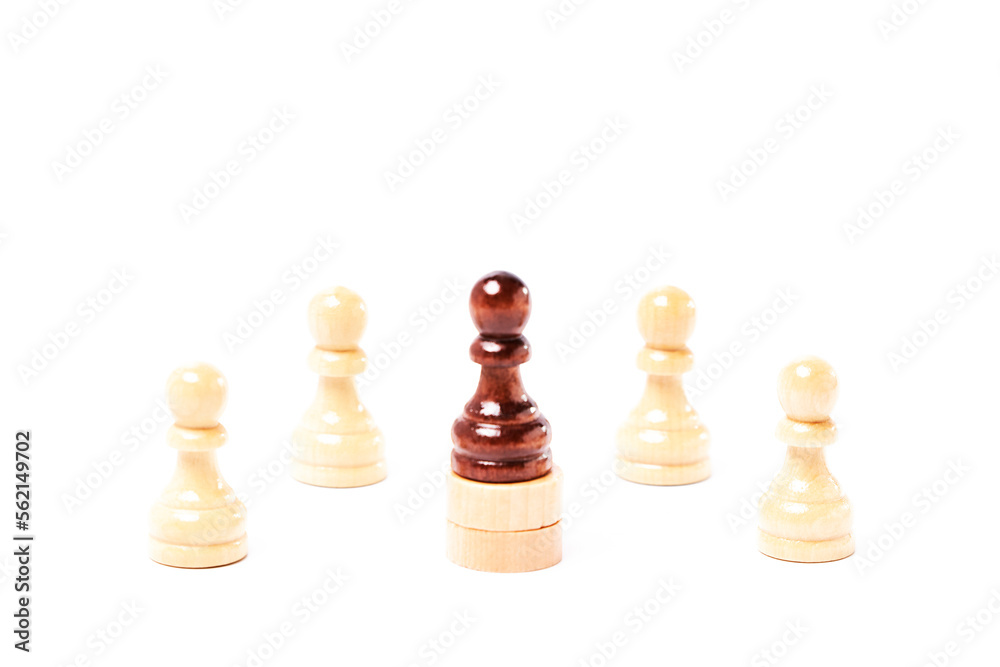 White chess pawns surrounding a black pawn on white background White chess pawns surrounding a black pawn on white background