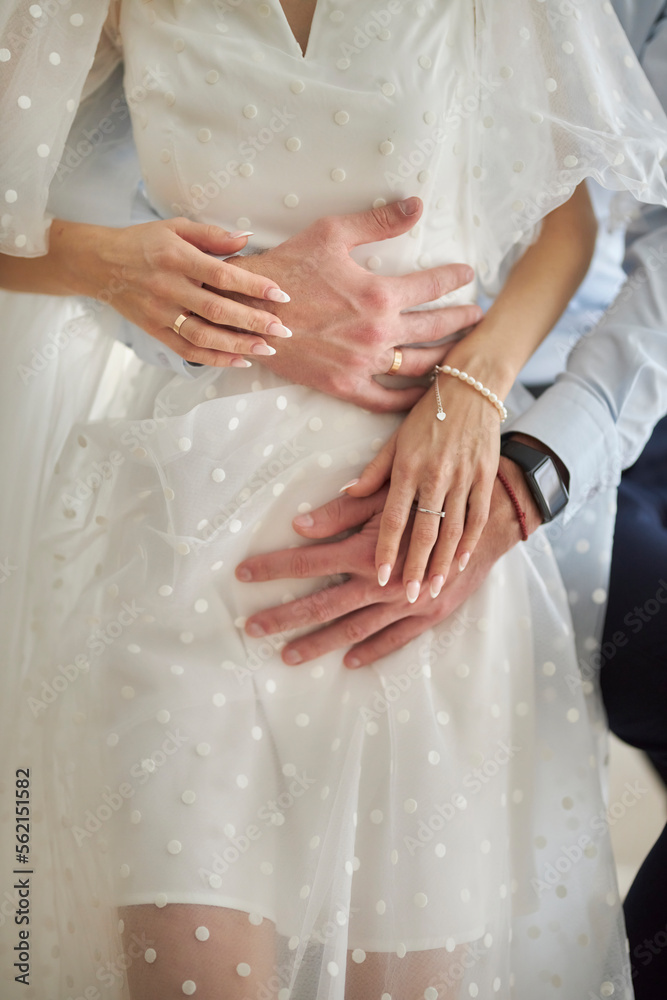 The bride and groom hold hands and hug. Wedding The concept of a wedding celebration 