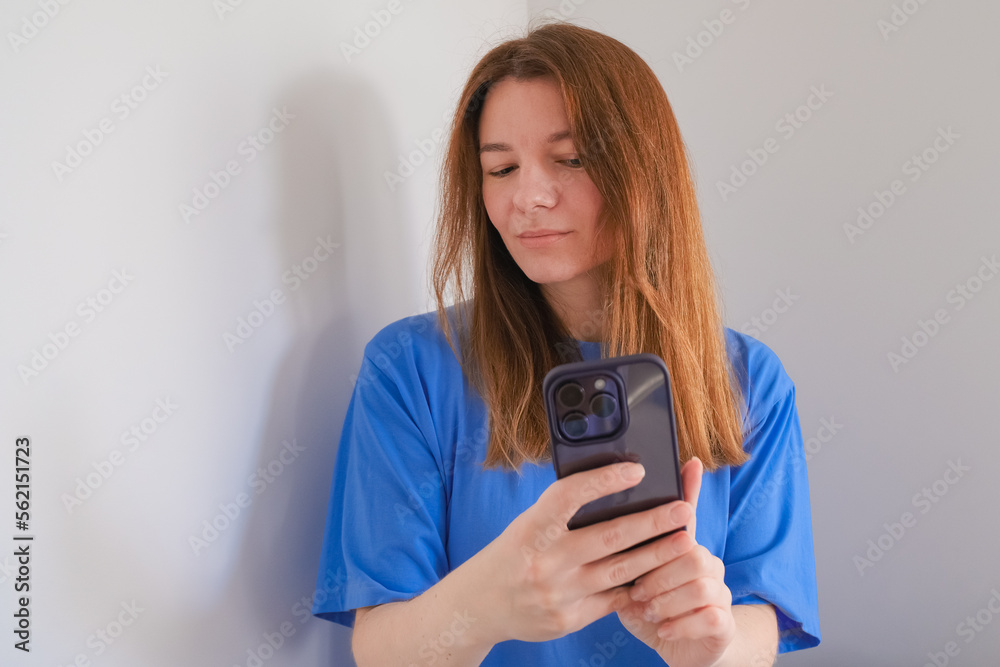 woman holding mobile phone on white background with copy space woman holding mobile phone on white background with copy space