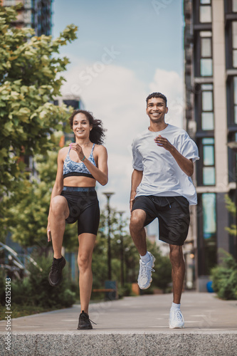 Athletic woman and a man enjoying their outdoor workout