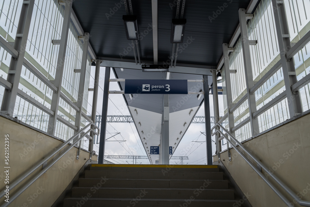 Entrance stairs to train station platforms from pedestrian underpass in Poland. Words in Polish language peron, tor and sektor means platform, track and sector. - obrazy, fototapety, plakaty 
