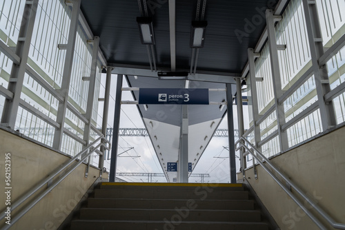 Entrance stairs to train station platforms from pedestrian underpass in Poland. Words in Polish language peron, tor and sektor means platform, track and sector.