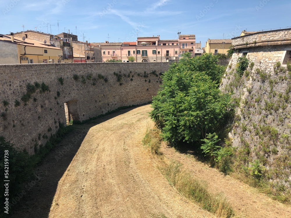 Walls of the Aragonese Castle with moat of Venosa historic city