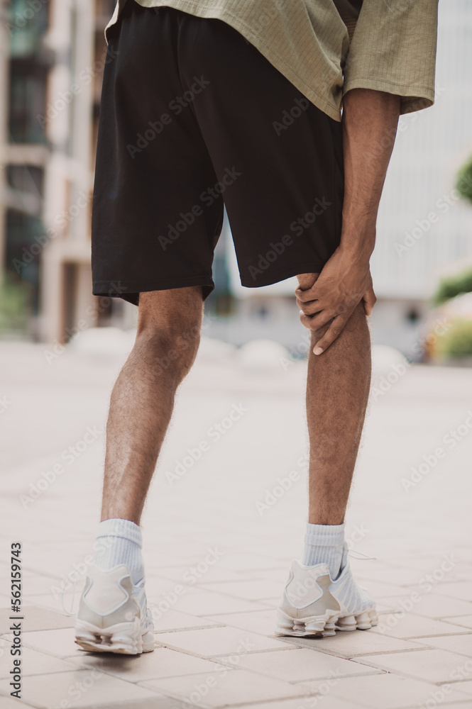 Professional male athlete suffering from hamstring strain Professional male athlete suffering from hamstring strain