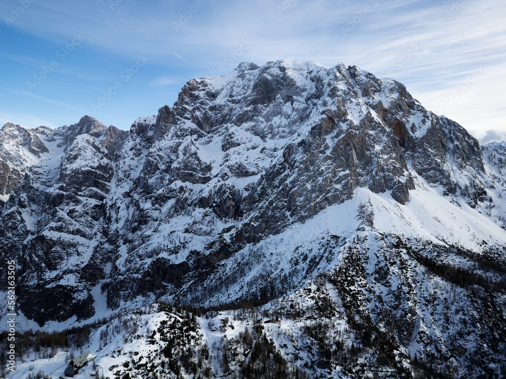 Amazing view of different mountain peaks with snow during winter in Triglav National Park. Beautiful mountain range and amazing attraction for alpine climbers. Adventurous lifestyle. 