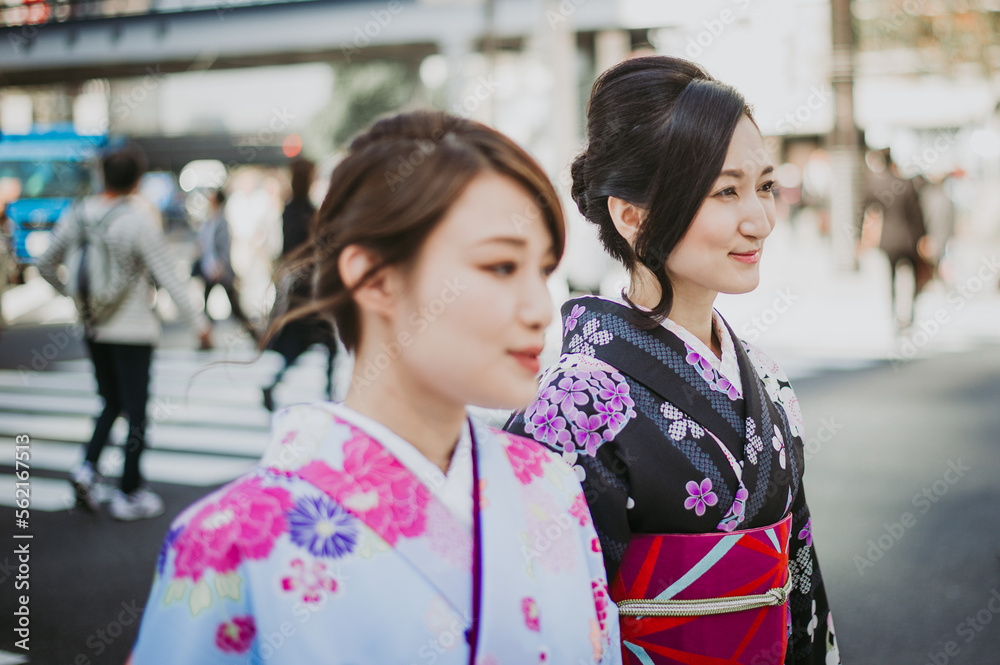 Two japanese girls wearing kimonos traditional clothes, lifestyle moments Two japanese girls wearing kimonos traditional clothes, lifestyle moments