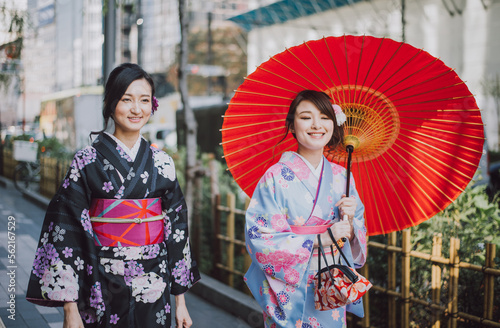 Two japanese girls wearing kimonos traditional clothes, lifestyle moments