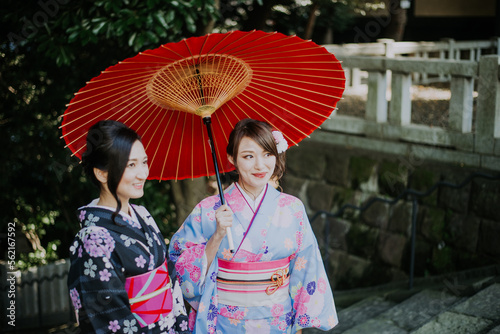 Two japanese girls wearing kimonos traditional clothes, lifestyle moments