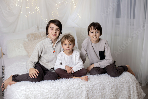 Family portrair of mother with her three children on white photo