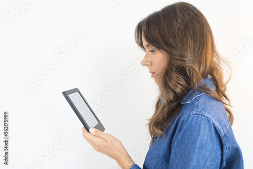 E-book Woman Reading a book on an E-reader