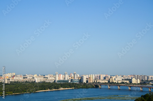 View from above of Paton Bridge and residential buildings of the left bank of Dnipro in Kyiv, Ukraine.