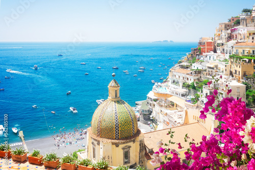 view of Positano - famous old italian resort at summer with flowers, Italy, toned image