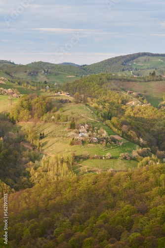 Amazing spring countryside landscape  houses and farmlands on the hills.