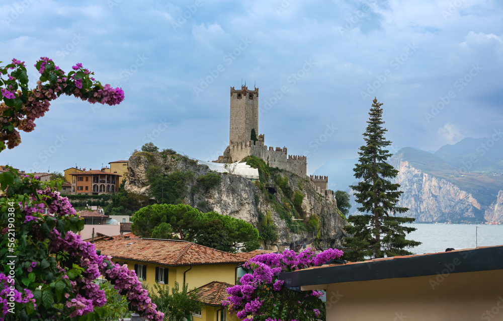 View to the castle of old town Malcesine with ancient tower and fortress at Garda lake, Veneto region, Italy.