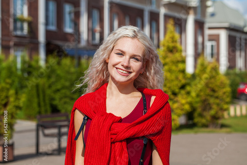 Portrait of a young beautiful blonde girl in an autumn park © Andrey_Arkusha
