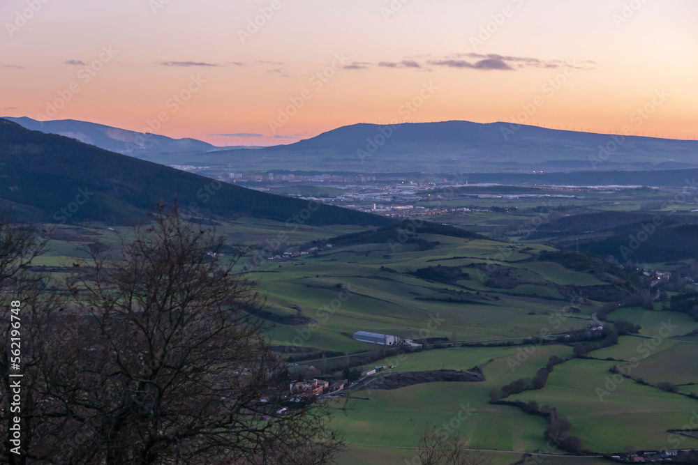 Juslapeña Valley at sunset. Pamplona Basin in the background