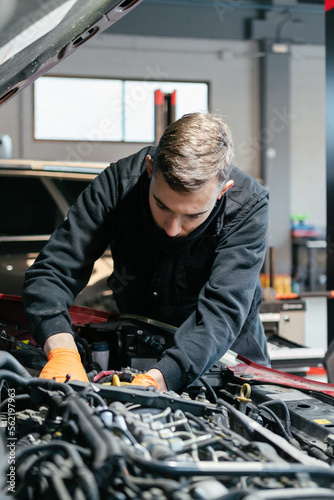 Car mechanic working in a garage