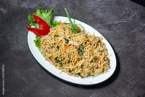 Chicken Chowmein served in dish isolated on grey background top view of indian and bangladesh food