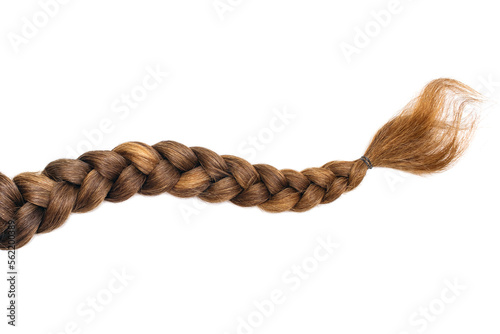Female hair in the form of a braid on a white isolated background. Red hair braided closeup. Beautiful healthy natural female hair